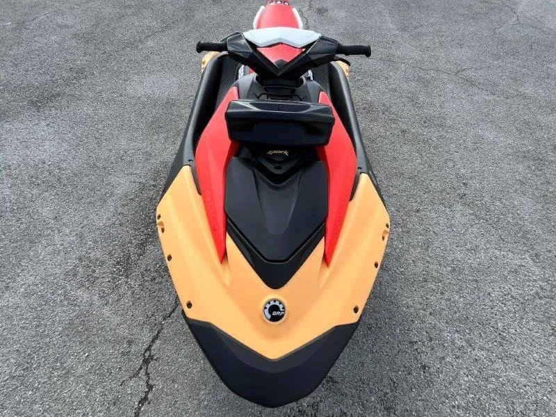 Slide: The Image of 2024 Sea-Doo Spark jet ski, top view, vibrant colors, on asphalt surface. - 20