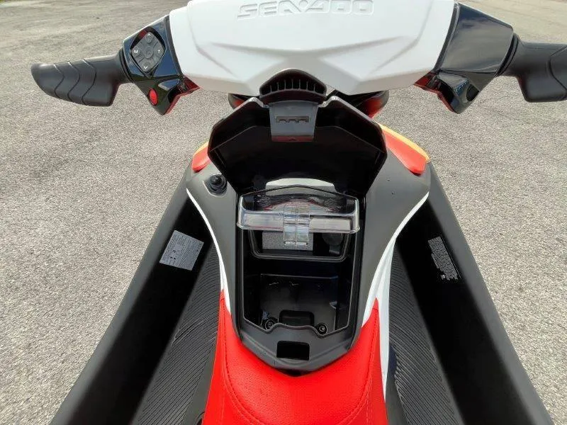 Slide: The Image of 2024 Sea-Doo Spark dashboard and storage compartment, featuring iBR and audio system. - 29