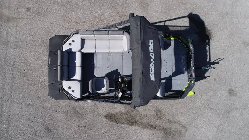 Slide: The Image of 2024 Sea-Doo SWITCH SPORT 18' 230HP pontoon boat, top view, spacious seating, black canopy. - 10