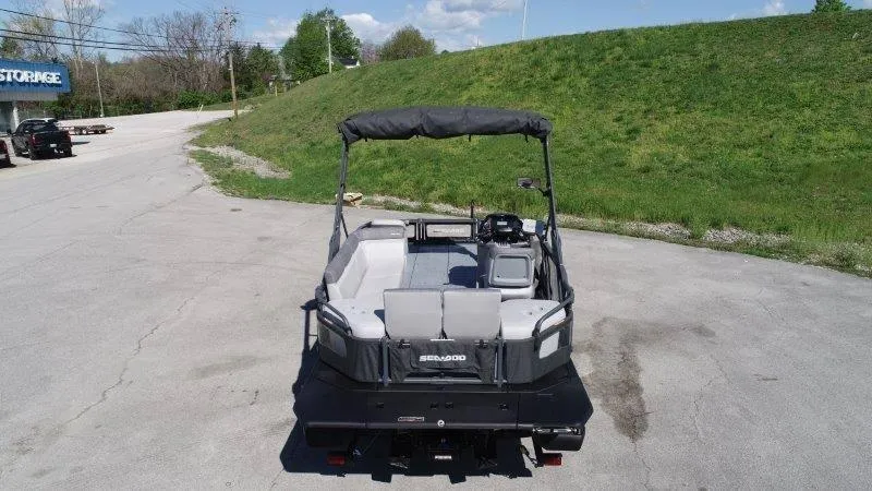 Slide: The Image of 2024 Sea-Doo SWITCH SPORT 18' 230HP boat parked outdoors, rear view. - 11