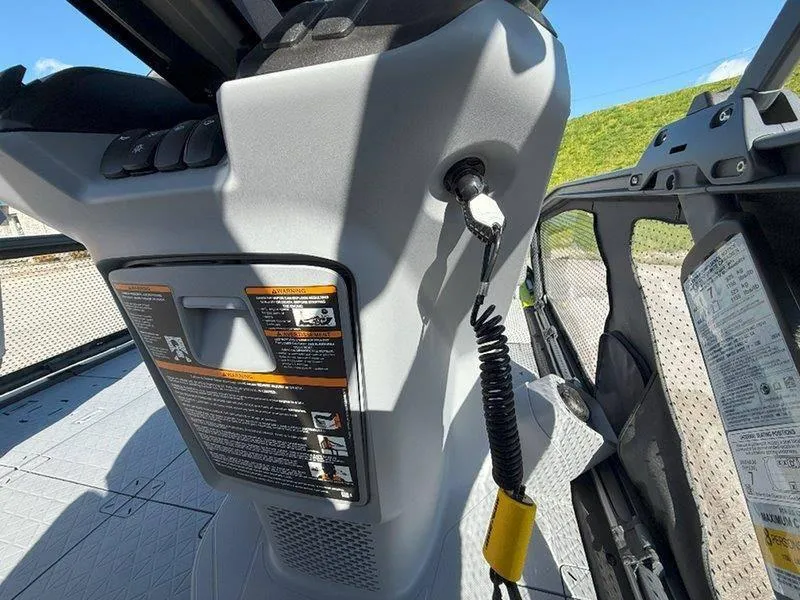 Slide: The Image of 2024 Sea-Doo SWITCH SPORT 18' 230HP dashboard with safety instructions and key tether. - 16