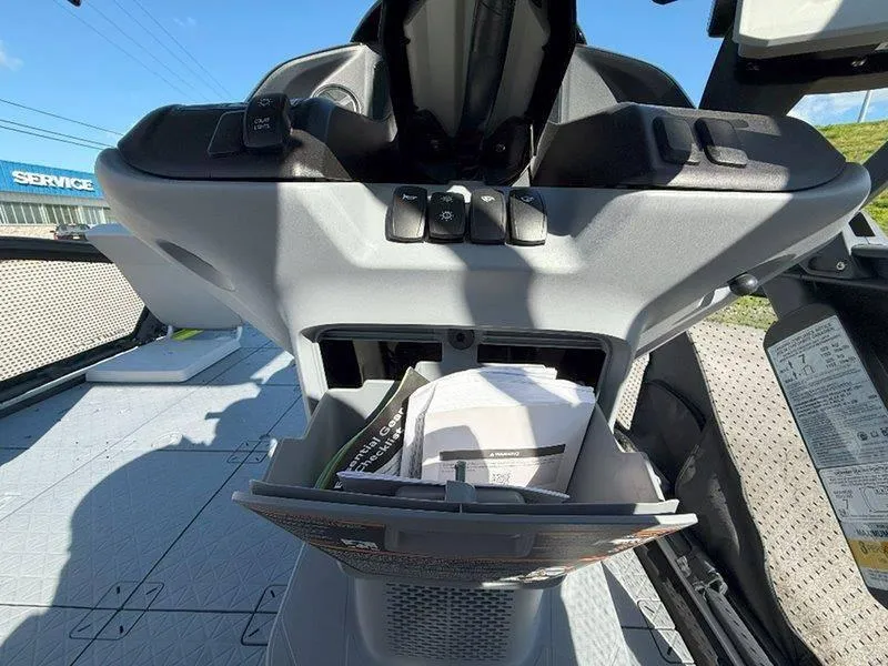 Slide: The Image of 2024 Sea-Doo SWITCH SPORT 18' 230HP dashboard with storage compartment and controls. - 28