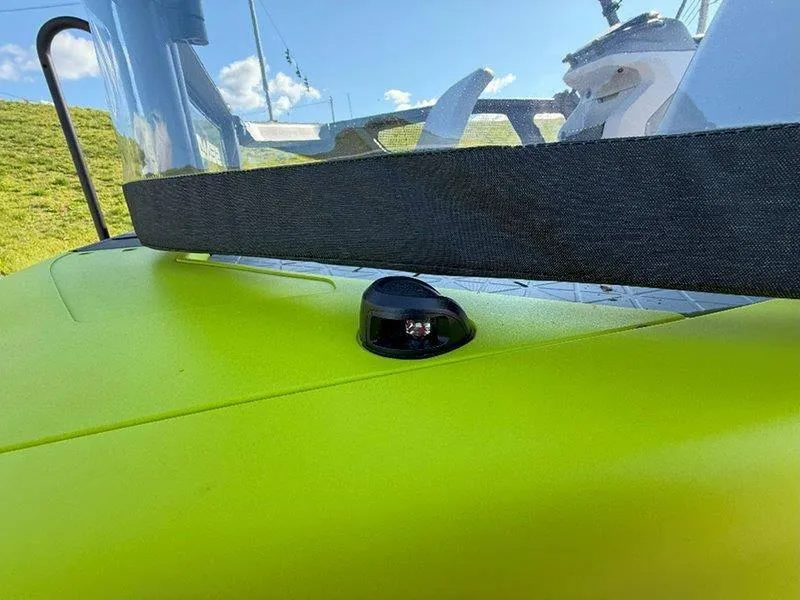 Slide: The Image of 2024 Sea-Doo SWITCH SPORT 18' 230HP, vibrant green deck detail, sunny day. - 29