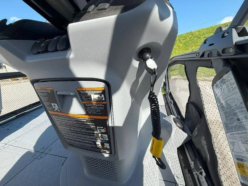 Slide: The Image of 2024 Sea-Doo SWITCH SPORT 18' 230HP dashboard with safety instructions and controls. - 33