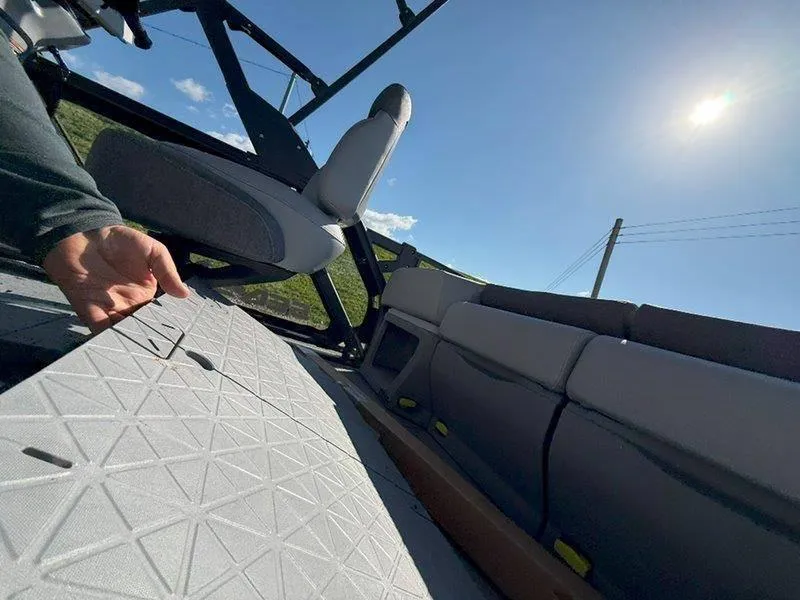 Slide: The Image of 2024 Sea-Doo SWITCH SPORT 18' interior with seating and flooring details under sunny sky. - 39