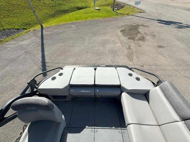Slide: The Image of 2024 Sea-Doo SWITCH SPORT 18' 230HP boat interior with gray seating and spacious layout. - 45