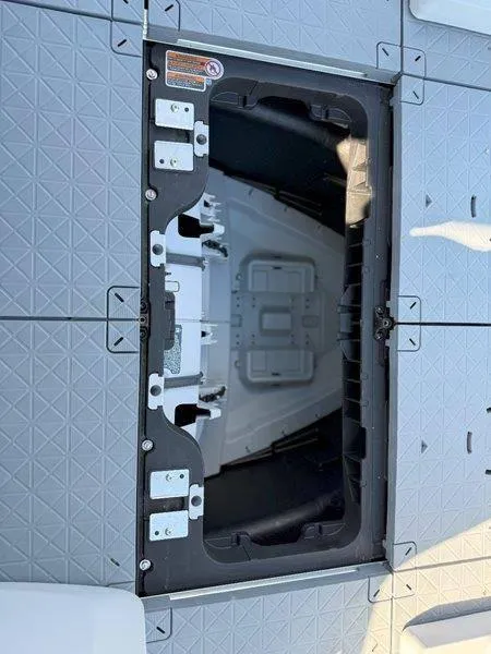 Slide: The Image of 2024 Sea-Doo SWITCH SPORT 18' 230HP storage compartment with open hatch, showcasing interior details. - 46