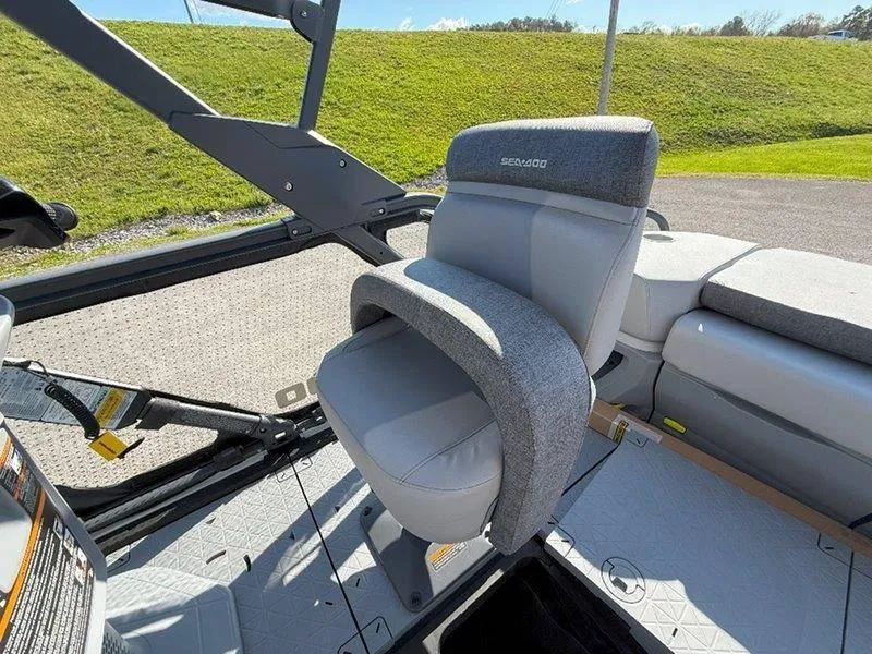 Slide: The Image of 2024 Sea-Doo SWITCH SPORT 18' 230HP boat seat with gray upholstery and armrest. - 48
