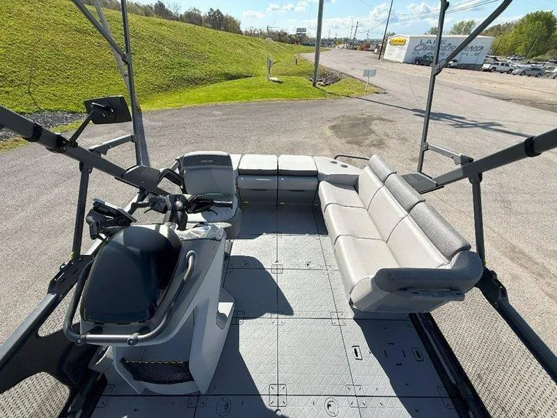 Slide: The Image of 2024 Sea-Doo SWITCH SPORT 18' 230HP interior with seating and controls, parked outdoors. - 49