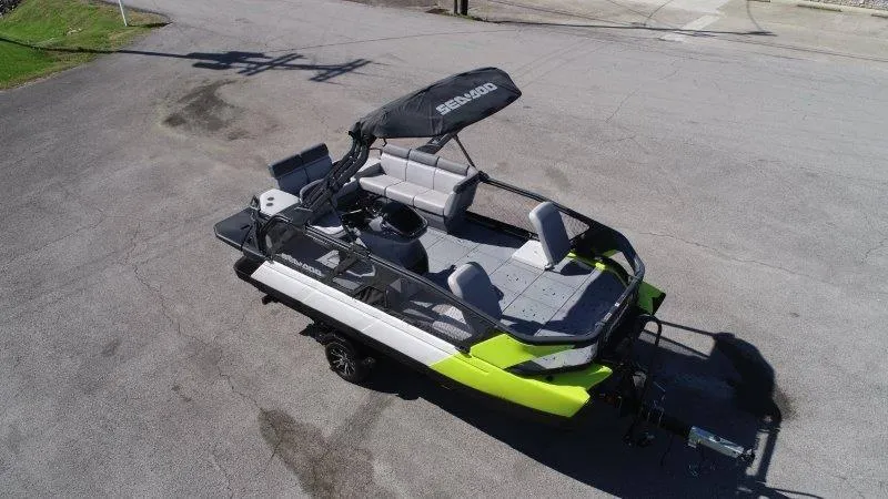 Slide: The Image of 2024 Sea-Doo SWITCH SPORT 18' 230HP boat, aerial view, parked on pavement. - 5
