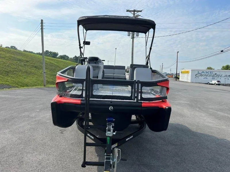 Slide: The Image of 2024 Sea-Doo SWITCH SPORT 18' 230HP on trailer, rear view in parking lot. - 16