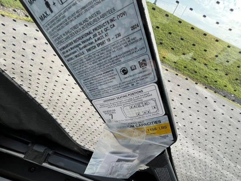 Slide: The Image of 2024 Sea-Doo SWITCH SPORT 18' 230HP capacity label, showing seating and weight limits. - 18