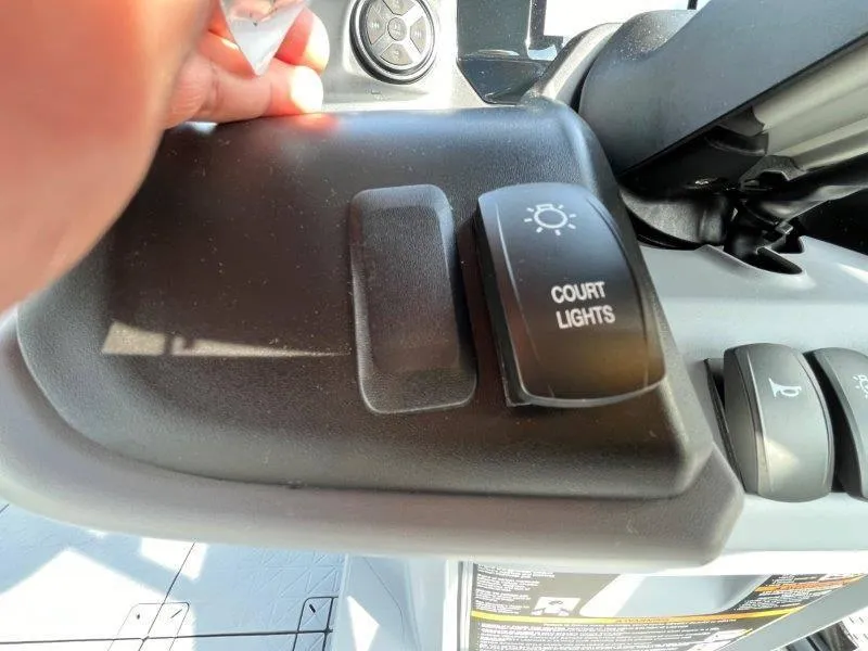 Slide: The Image of 2024 Sea-Doo SWITCH SPORT 18' dashboard with court lights switch. - 24