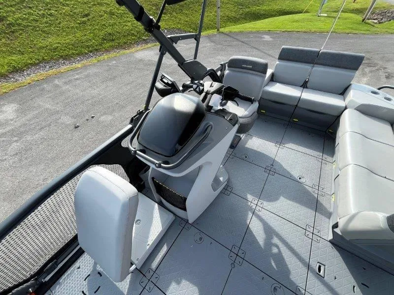 Slide: The Image of 2024 Sea-Doo SWITCH SPORT 18' 230HP interior with seating and helm controls. - 30