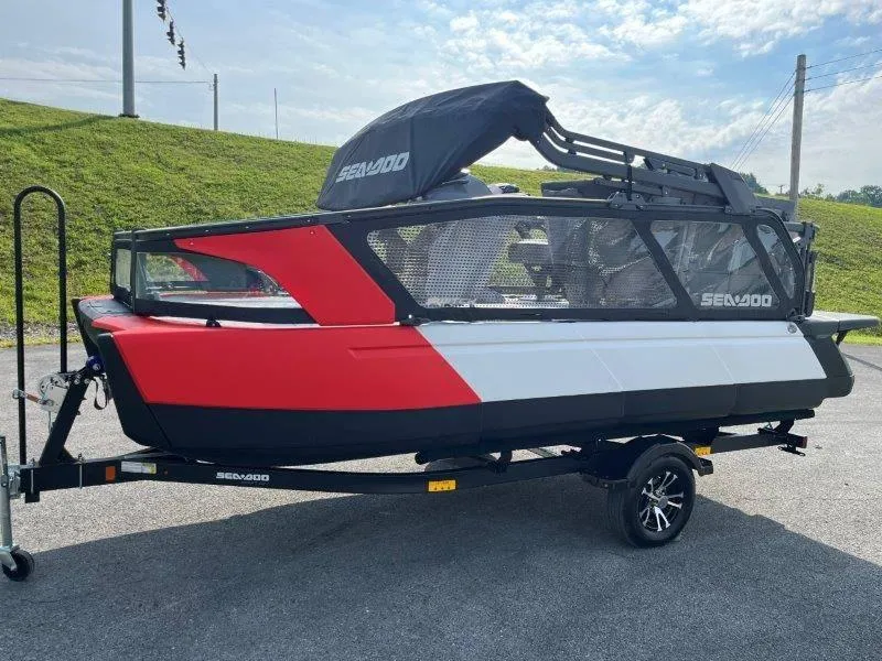 Slide: The Image of 2024 Sea-Doo SWITCH SPORT 18' 230HP on trailer, red and white design, outdoor display. - 38