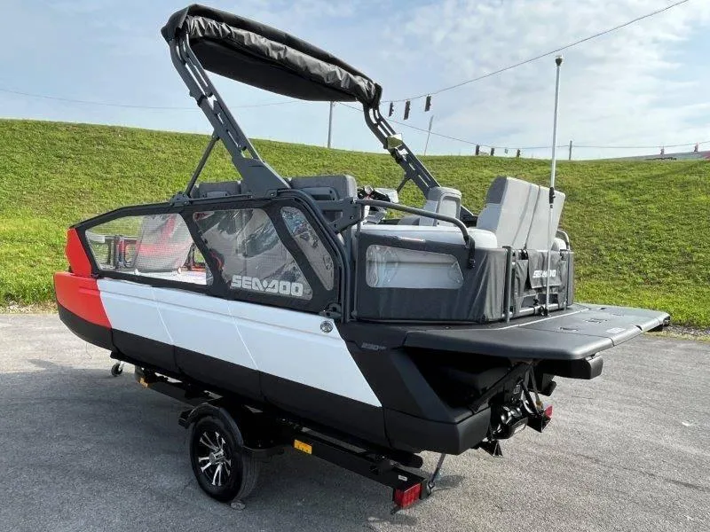 Slide: The Image of 2024 Sea-Doo SWITCH SPORT 18' 230HP boat on trailer, outdoor setting. - 4