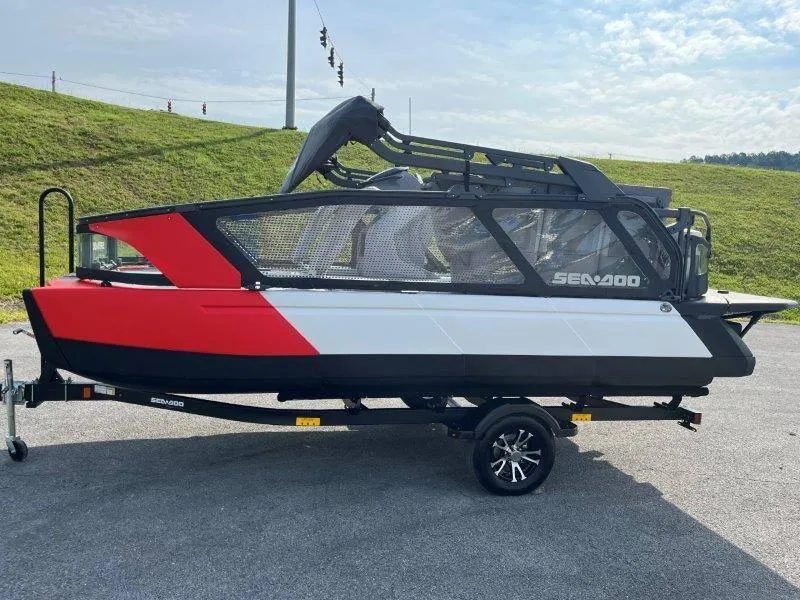 Slide: The Image of 2024 Sea-Doo SWITCH SPORT 18' 230HP boat on trailer, red and white design. - 40