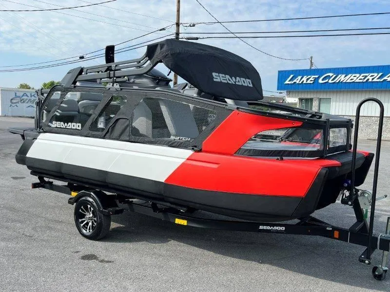 Slide: The Image of 2024 Sea-Doo SWITCH SPORT 18' 230HP on trailer, red and white design, parked outdoors. - 47