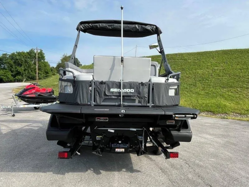 Slide: The Image of 2024 Sea-Doo SWITCH SPORT 18' 230HP boat, rear view on pavement. - 8