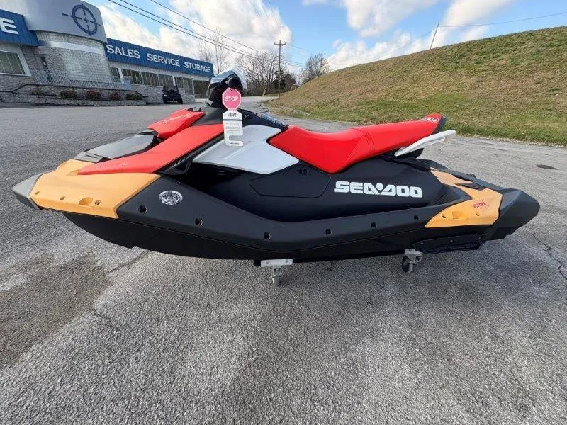 Slide: The Image of 2024 Sea-Doo Spark for 3 Rotax 900 ACE-90 with iBR, parked outdoors. - 10