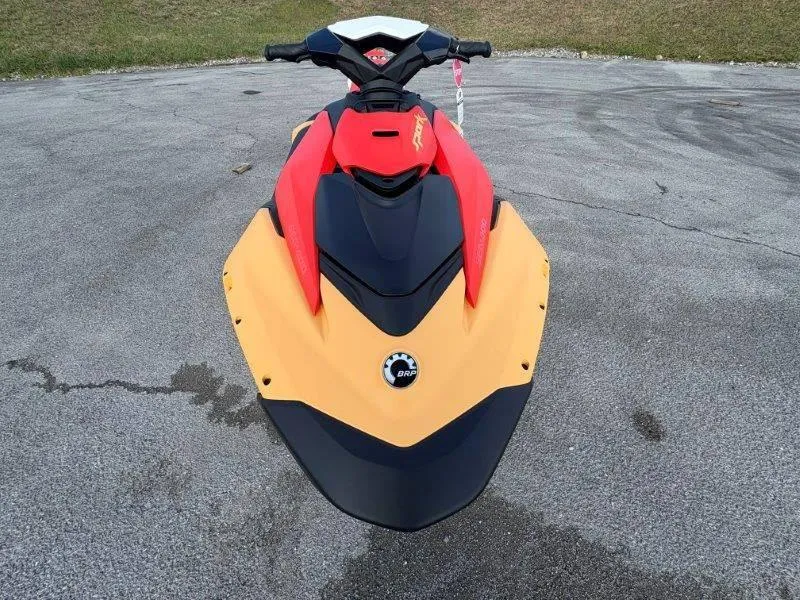 Slide: The Image of 2024 Sea-Doo Spark for 3 Rotax 900 ACE-90 with iBR, vibrant red and yellow design. - 11