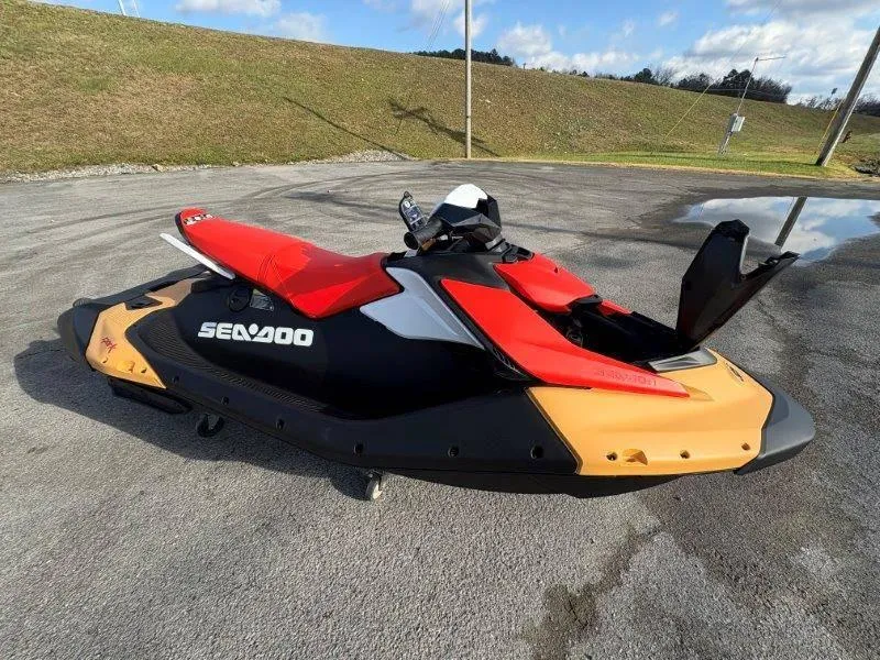 Slide: The Image of 2024 Sea-Doo Spark for 3 Rotax 900 ACE-90 with iBR, parked outdoors. - 13