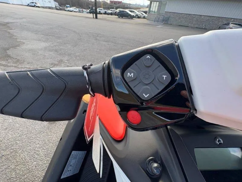 Slide: The Image of Close-up of 2024 Sea-Doo Spark handlebar controls with VTS buttons and red start button. - 28