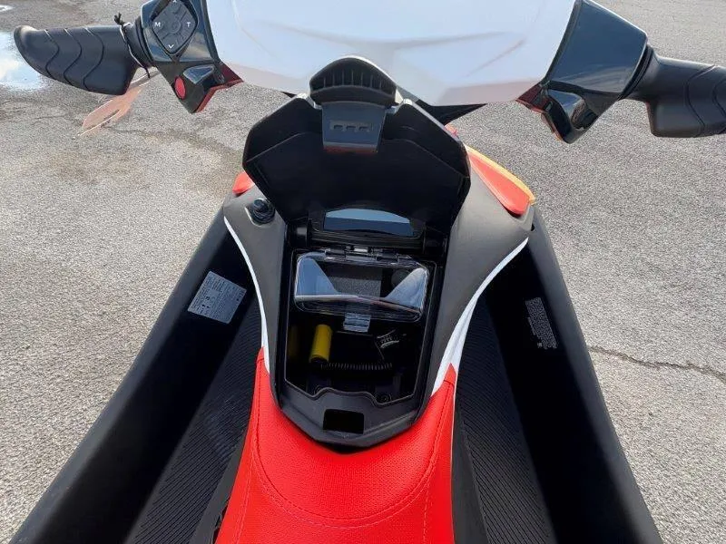 Slide: The Image of 2024 Sea-Doo Spark Rotax 900 ACE-90, open storage compartment, red and black design. - 3