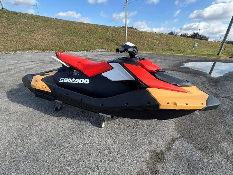 Slide: The Image of 2024 Sea-Doo Spark Rotax 900 ACE-90 jet ski with iBR, parked on pavement. - 31