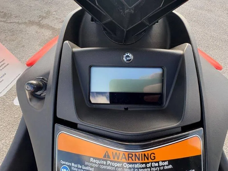 Slide: The Image of 2024 Sea-Doo Spark dashboard with warning label and display screen. - 4