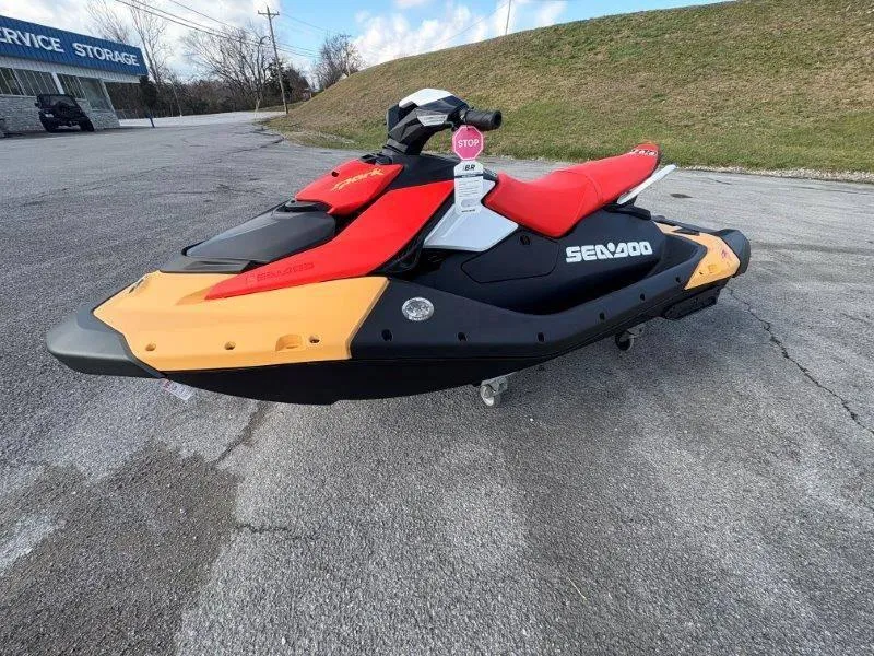 Slide: The Image of 2024 Sea-Doo Spark for 3 Rotax 900 ACE-90 with iBR, parked on pavement. - 9