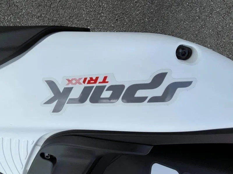 Slide: The Image of 2024 Sea-Doo Spark Trixx logo on white surface, close-up view. - 20
