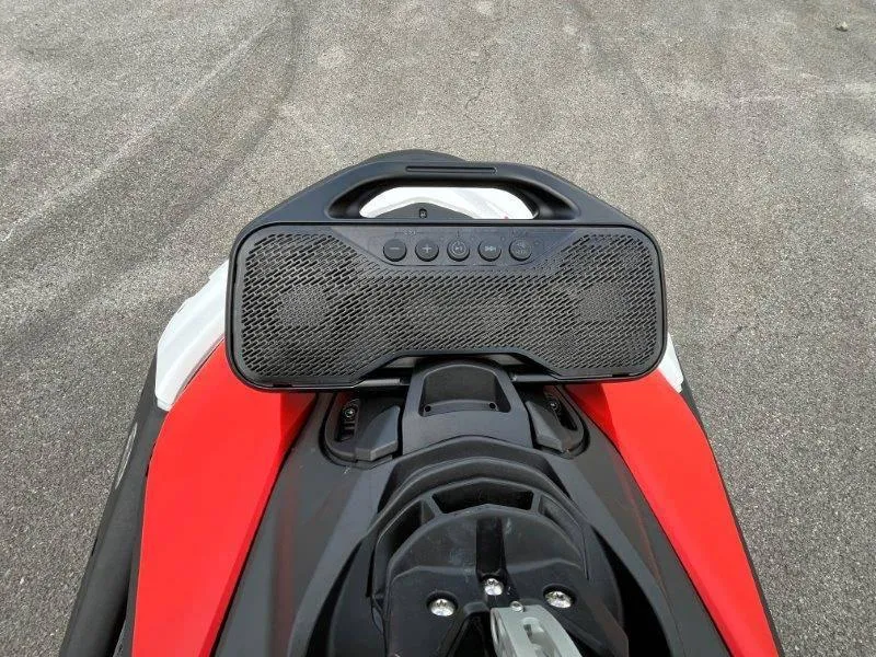 Slide: The Image of 2024 Sea-Doo Spark Trixx with audio system, red and black design. - 27