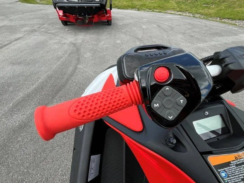 Slide: The Image of Close-up of 2024 Sea-Doo Spark Trixx handlebar controls and red grip. - 28