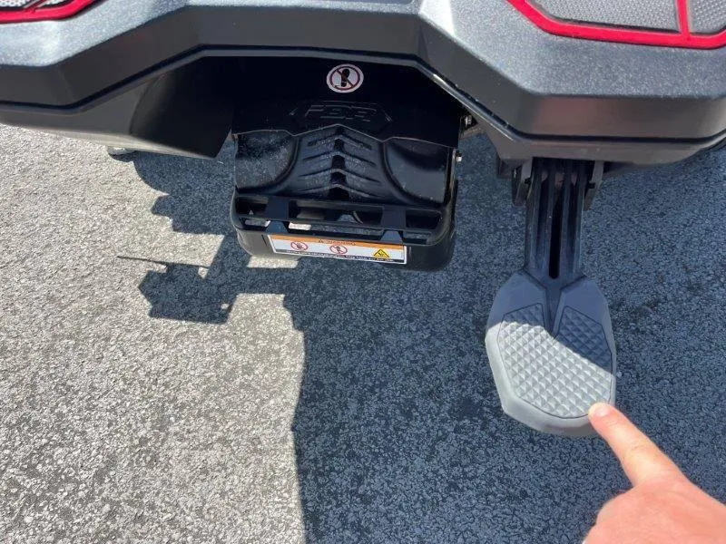 Slide: The Image of Close-up of 2022 Sea-Doo Spark Trixx 3 Up Sound footrest and rear mechanism. - 12