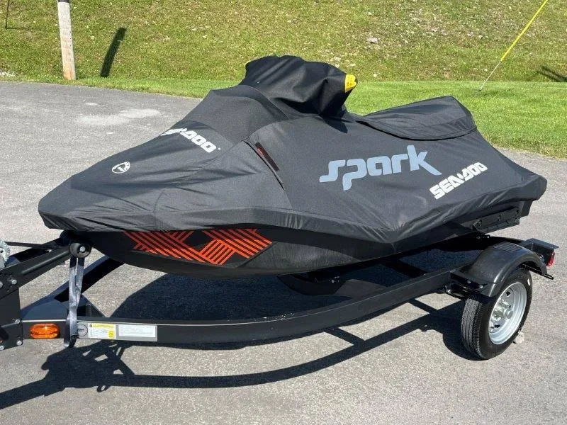 Slide: The Image of 2022 Sea-Doo Spark Trixx 3 Up Sound jet ski covered on trailer. - 26