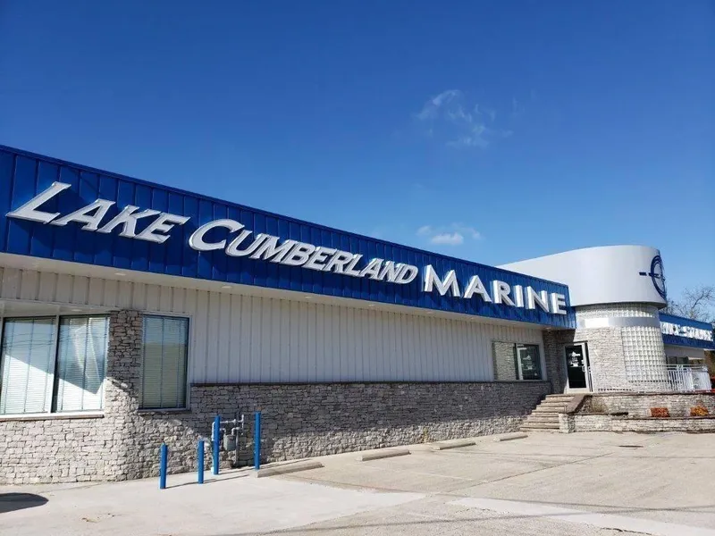 Slide: The Image of Lake Cumberland Marine building under clear blue sky. - 42