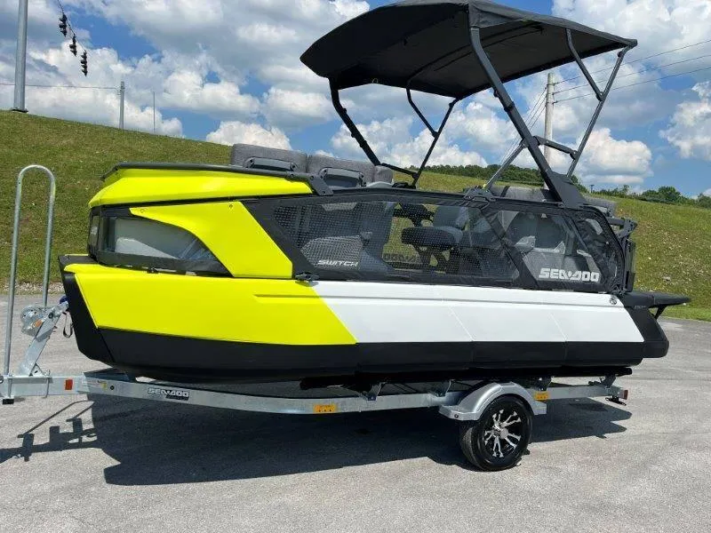 Slide: The Image of 2024 Sea-Doo Switch Cruise 18' 230hp on trailer, vibrant yellow and black design. - 11