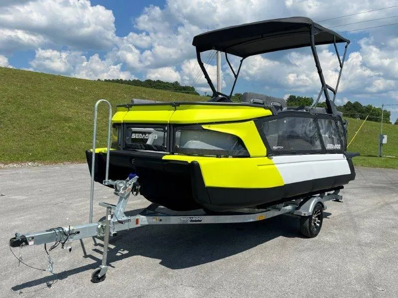Slide: The Image of 2024 Sea-Doo Switch Cruise 18' 230hp on trailer, vibrant yellow and black design. - 12