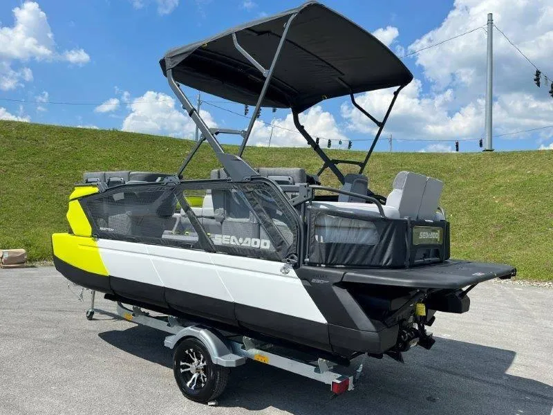 Slide: The Image of 2024 Sea-Doo Switch Cruise 18' 230hp boat on trailer, parked outdoors. - 14