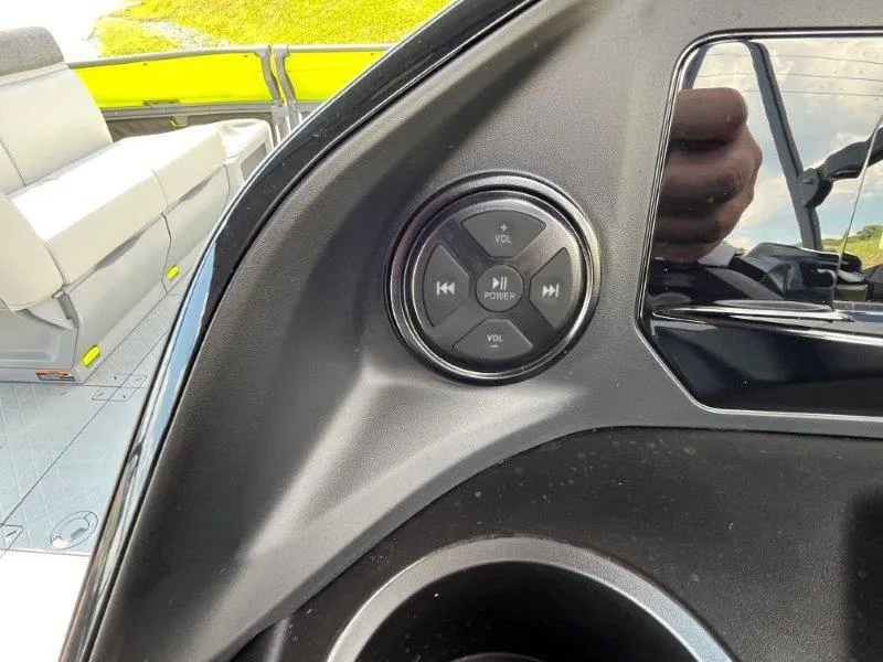 Slide: The Image of 2024 Sea-Doo Switch Cruise 18' dashboard with audio controls and seating area. - 22