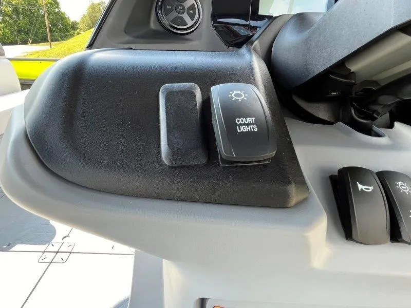 Slide: The Image of 2024 Sea-Doo Switch Cruise dashboard with court lights switch. - 23