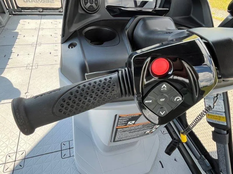 Slide: The Image of 2024 Sea-Doo Switch Cruise 18' 230hp steering controls with buttons and grip handle. - 24