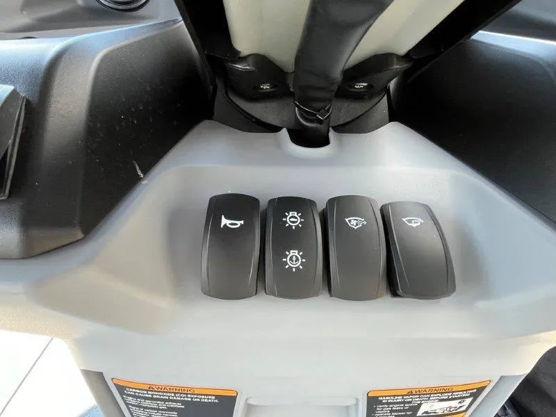 Slide: The Image of 2024 Sea-Doo Switch Cruise 18' control panel with switches for horn, lights, and accessories. - 26