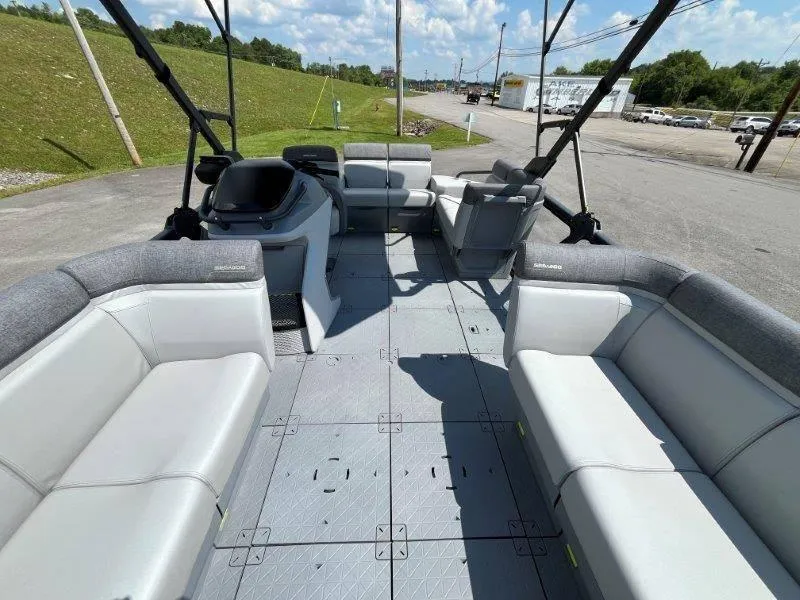 Slide: The Image of 2024 Sea-Doo Switch Cruise 18' 230hp pontoon boat interior with spacious seating. - 29
