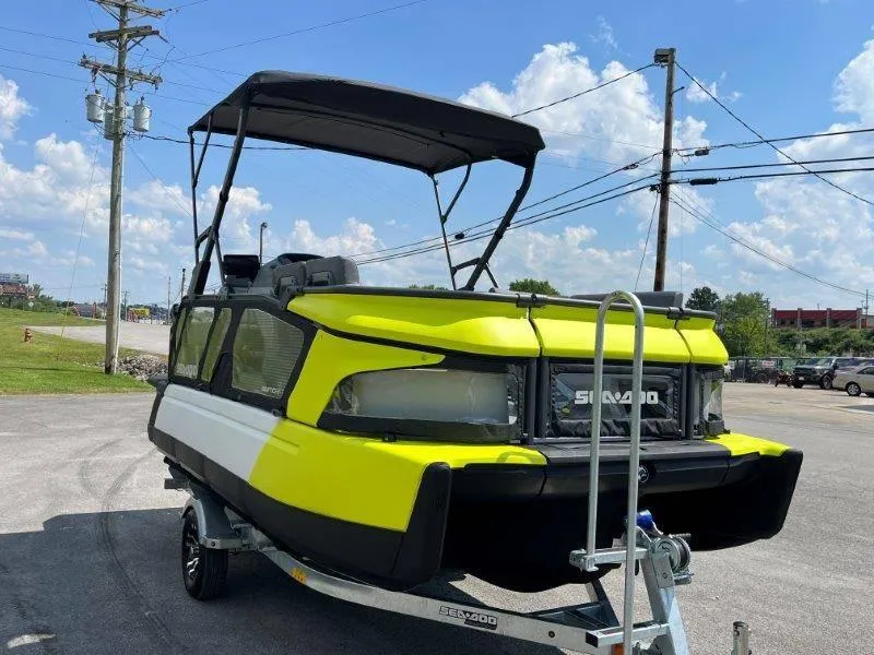 Slide: The Image of 2024 Sea-Doo Switch Cruise 18' 230hp on trailer, bright yellow, parked outdoors. - 3