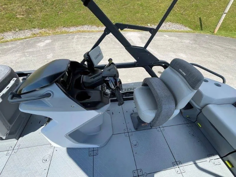 Slide: The Image of 2024 Sea-Doo Switch Cruise 18' 230hp cockpit with steering and seating area. - 30