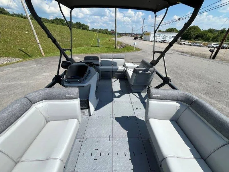 Slide: The Image of 2024 Sea-Doo Switch Cruise 18' 230hp interior with spacious seating and canopy. - 32