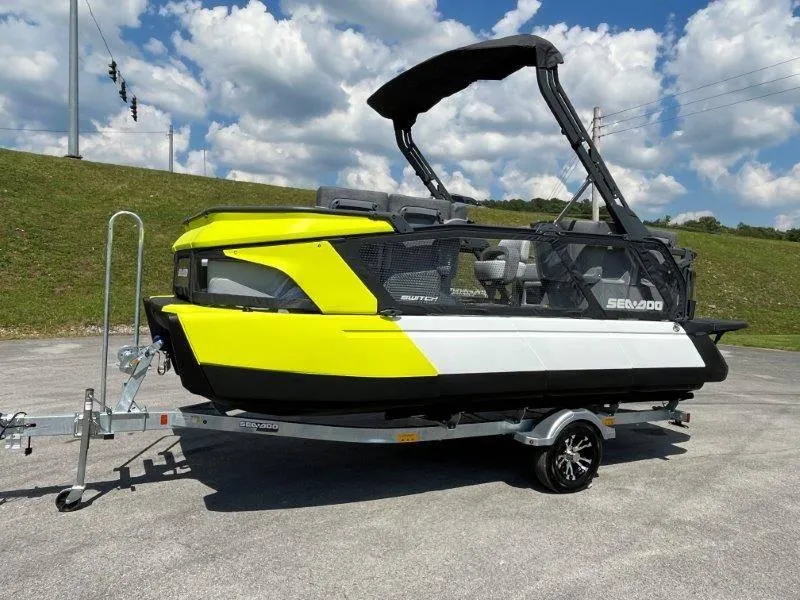 Slide: The Image of 2024 Sea-Doo Switch Cruise 18' 230hp on trailer, vibrant yellow and black design. - 40