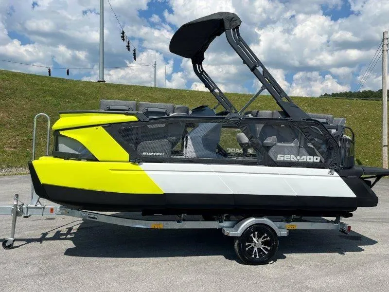 Slide: The Image of 2024 Sea-Doo Switch Cruise 18' 230hp on trailer, vibrant yellow and black design. - 41